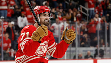 Dec 2, 2025; Detroit, Michigan, USA;  Detroit Red Wings center Dylan Larkin (71) celebrates a goal by defenseman Ben Chiarot (not pictured) in the second period against the Boston Bruins at Little Caesars Arena. Mandatory Credit: Rick Osentoski-Imagn Images