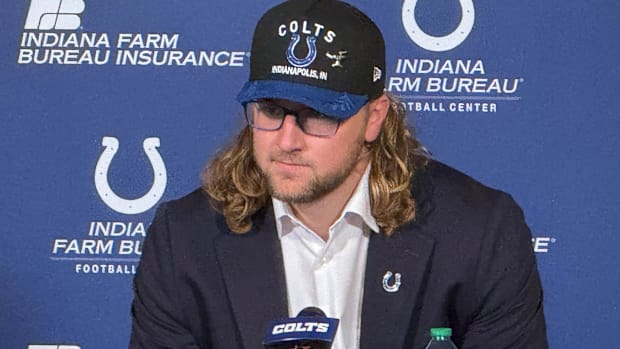Colts tight end Tyler Warren (blue background) speaks to the Indianapolis media after being drafted.