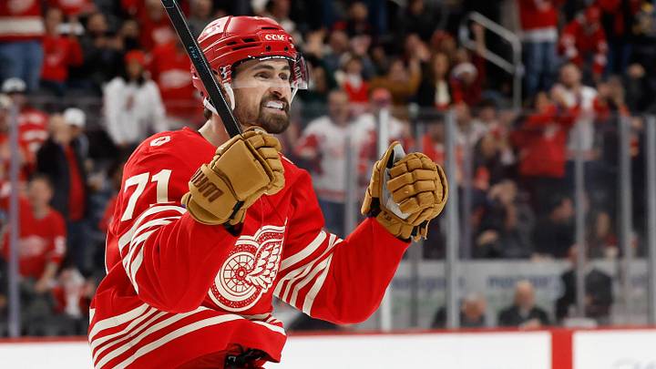 Dec 2, 2025; Detroit, Michigan, USA;  Detroit Red Wings center Dylan Larkin (71) celebrates a goal by defenseman Ben Chiarot (not pictured) in the second period against the Boston Bruins at Little Caesars Arena. Mandatory Credit: Rick Osentoski-Imagn Images