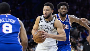 Jan 25, 2023; Philadelphia, Pennsylvania, USA; Brooklyn Nets guard Ben Simmons (10) controls the ball in front of Philadelphia 76ers center Joel Embiid (21) during the second quarter at Wells Fargo Center. Mandatory Credit: Bill Streicher-Imagn Images