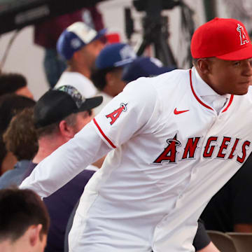 Jul 14, 2024; Ft. Worth, TX, USA;  Christian Moore celebrates with fans after being selected by the Los Angeles Angels as the eight player taken during the first round of the MLB Draft at Cowtown Coliseum. 