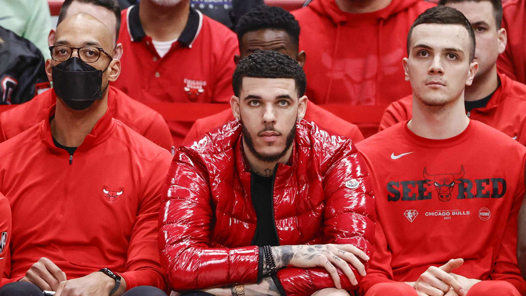 Apr 22, 2022; Chicago, Illinois, USA; Chicago Bulls guard Lonzo Ball (center) looks on from the bench during the second half of Game 3 of the first round for the 2022 NBA playoffs against the Milwaukee Bucks at United Center. 