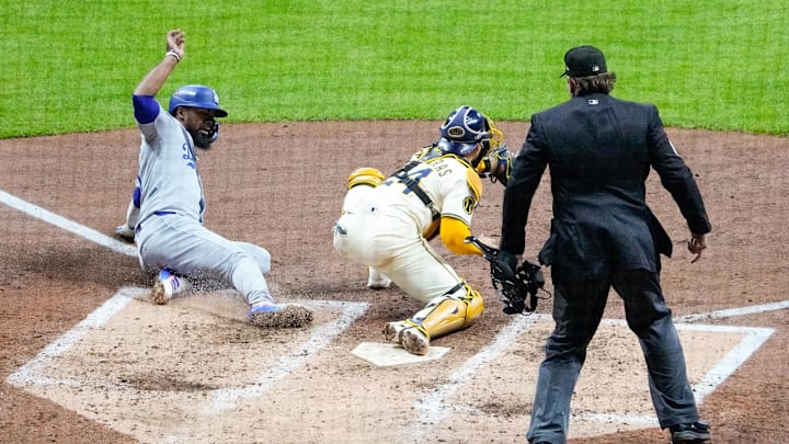 Dodgers right fielder Teoscar Hernandez was thrown out at home plate in the fourth inning against the Brewers in NLCS Game 1. Dodgers right fielder Teoscar Hernandez was thrown out at home plate in the fourth inning against the Brewers in NLCS Game 1.