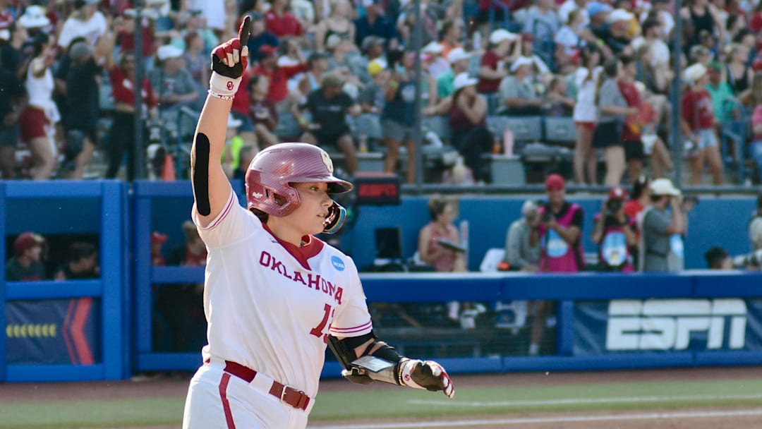 Oklahoma catcher Isabela Emerling rounds first after hitting a home run at the Women's College World Series.