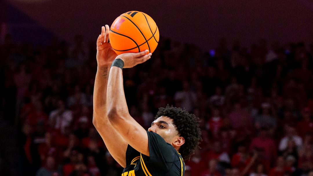Mar 8, 2026; Lincoln, Nebraska, USA; Iowa Hawkeyes guard Kael Combs (11) shoots a three-point shot to force overtime against the Nebraska Cornhuskers during the second half at Pinnacle Bank Arena. Mandatory Credit: Dylan Widger-Imagn Images