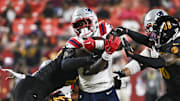 Aug 25, 2024; Landover, Maryland, USA; New England Patriots running back Terrell Jennings (29)  runs through the line during the second  half against the Washington Commanders at Commanders Field. Mandatory Credit: Tommy Gilligan-Imagn Images