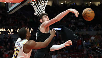Apr 13, 2025; Portland, Oregon, USA; Portland Trail Blazers center Donovan Clingan (23) blocks Los Angeles Lakers center Trey Jemison III (55) in the second half at Moda Center. Mandatory Credit: Jaime Valdez-Imagn Images