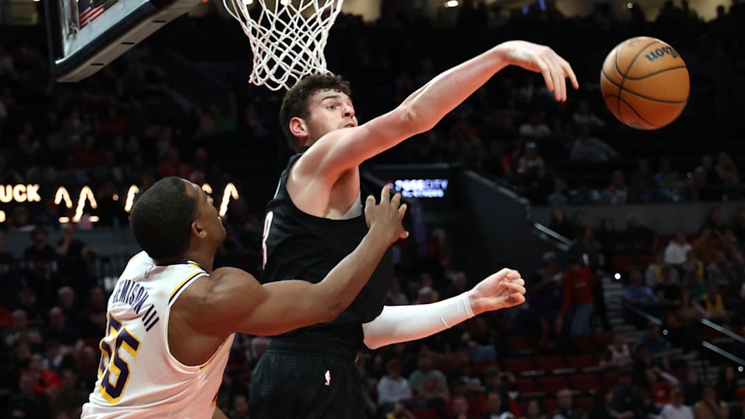 Apr 13, 2025; Portland, Oregon, USA; Portland Trail Blazers center Donovan Clingan (23) blocks Los Angeles Lakers center Trey Jemison III (55) in the second half at Moda Center. Mandatory Credit: Jaime Valdez-Imagn Images