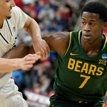 Mar 21, 2025; Raleigh, NC, USA; Mississippi State Bulldogs forward RJ Melendez (22) defends against Baylor Bears guard VJ Edgecombe (7) during the second half in the first round of the NCAA Tournament at Lenovo Center. Mandatory Credit: Zachary Taft-Imagn Images