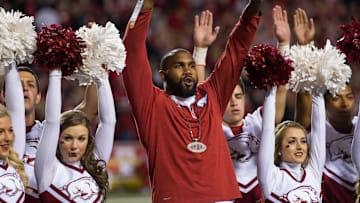 Nov 12, 2016; Fayetteville, AR, USA;  Arkansas Razorbacks former running back Darren McFadden (center) is honored between quarters and helps the spirit squad lead the crowd in a cheer during the game against the LSU Tigers at Donald W. Reynolds Razorback Stadium. LSU won 38-10. Mandatory Credit: Brett Rojo-Imagn Images