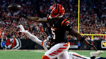 Denver Broncos cornerback Riley Moss (21) is called for pass interference on Cincinnati Bengals wide receiver Tee Higgins (5) in the second quarter of the NFL game at Paycor Stadium in Cincinnati on Saturday, Dec. 28, 2024.