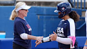 Jocelyn Alo high fives Patty Gasso after hitting a home run in the USA Softball Showcase at Devon Park.