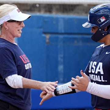 Jocelyn Alo high fives Patty Gasso after hitting a home run in the USA Softball Showcase at Devon Park.