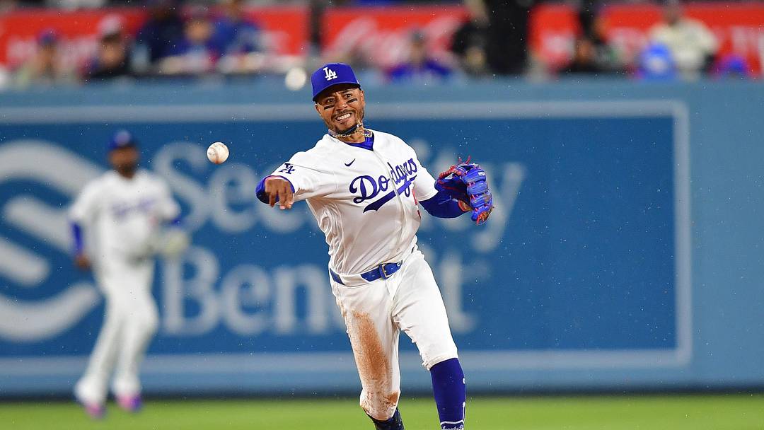 Mar 31, 2026; Los Angeles, California, USA; Los Angeles Dodgers shortstop Mookie Betts (50) throws to first for the out against Cleveland Guardians shortstop Gabriel Arias (13) during the fifth inning at Dodger Stadium. Mandatory Credit: Gary A. Vasquez-Imagn Images