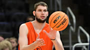 Mar 20, 2025; Milwaukee, WI, USA; Illinois Fighting Illini center Tomislav Ivisic (13) works out NCAA Tournament First Round Practice at Fiserv Forum. Mandatory Credit: Benny Sieu-Imagn Images