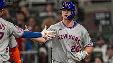 Aug 23, 2025; Cumberland, Georgia, USA; New York Mets first baseman Pete Alonso (20) reacts with third baseman Mark Vientos (27) after hitting a two run home run against the Atlanta Braves during the seventh inning at Truist Park. Mandatory Credit: Dale Zanine-Imagn Images