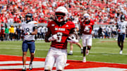 Sep 6, 2025; Raleigh, North Carolina, USA; North Carolina State Wolfpack running back Hollywood Smothers (3) runs with the football to score a touchdown during the second half of the game against Virginia Cavaliers at Carter-Finley Stadium. Mandatory Credit: Jaylynn Nash-Imagn Images