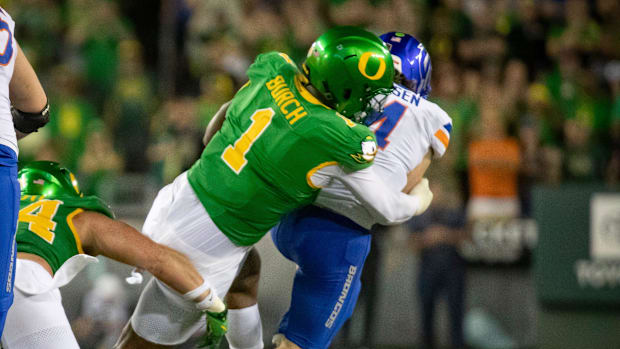 Oregon defensive end Jordan Burch brings down Boise State quarterback Maddux Madsen as the Oregon Ducks host the Boise State 