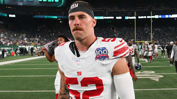 Aug 24, 2024; East Rutherford, New Jersey, USA; New York Giants linebacker Carter Coughlin (52) walks off the field following the game against the New York Jets at MetLife Stadium. Mandatory Credit: Rich Barnes-Imagn Images