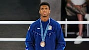 Omari Jones (USA) and Lewis Richardson (GBR) receive their bronze medals in a men’s 71kg victory ceremony during the Paris 2024 Olympic Summer Games at Stade Roland Garros. 