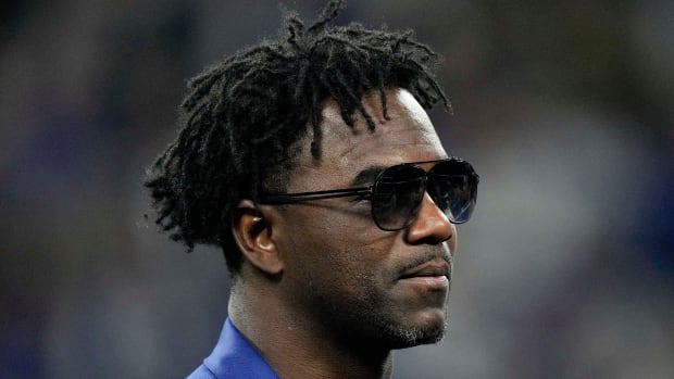 Former Indianapolis Colts player Edgerrin James stands on the podium during a Ring of Honor induction ceremony 