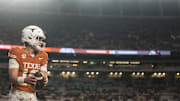 Nov 28, 2025; Austin, Texas, USA; Texas Longhorns quarterback Arch Manning warms up before a game against the Texas A&M Aggies at Darrell K Royal-Texas Memorial Stadium. 