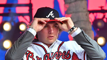 Jul 17, 2022; Los Angeles, CA, USA;  Former Atlanta Braves player Fred McGriff presents JR Ritchie right with his jersey after he was selected by the Atlanta Braves as the 35th pick of the MLB draft at XBox Plaza at LA Live. Mandatory Credit: Jayne Kamin-Oncea-Imagn Images