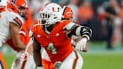 Nov 8, 2025; Miami Gardens, Florida, USA; Miami Hurricanes defensive lineman Rueben Bain Jr. (4) rushes the passer against the Syracuse Orange during the third quarter at Hard Rock Stadium. Mandatory Credit: Jeff Romance-Imagn Images