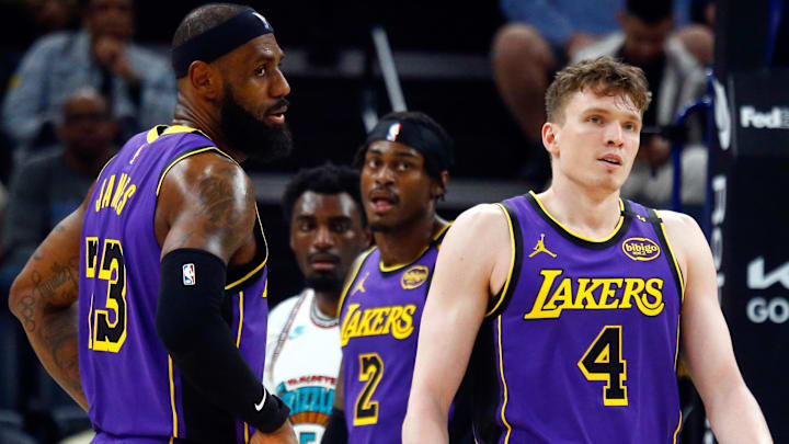  Los Angeles Lakers forward LeBron James (23) and guard Dalton Knecht (4) react during the second quarter against the Memphis Grizzlies at FedExForum.