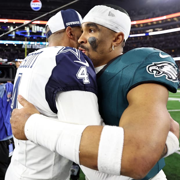 Dallas Cowboys quarterback Dak Prescott hugs Philadelphia Eagles quarterback Jalen Hurts 