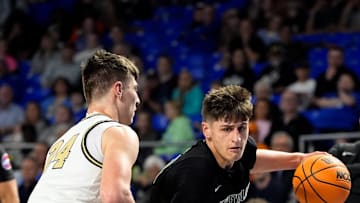 Greeneville's Trey Thompson (21) bolts past Upperman's Colton Johnson (24) during the first quarter of a TSSAA Class 3A basketball state semifinal game at the Murphy Center in Murfreesboro, Tenn., Friday, March 21, 2025.
