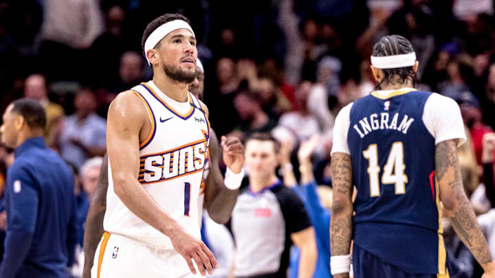 Dec 5, 2024; New Orleans, Louisiana, USA;  Phoenix Suns guard Devin Booker (1) looks on against the New Orleans Pelicans during the second half  at Smoothie King Center. Mandatory Credit: Stephen Lew-Imagn Images