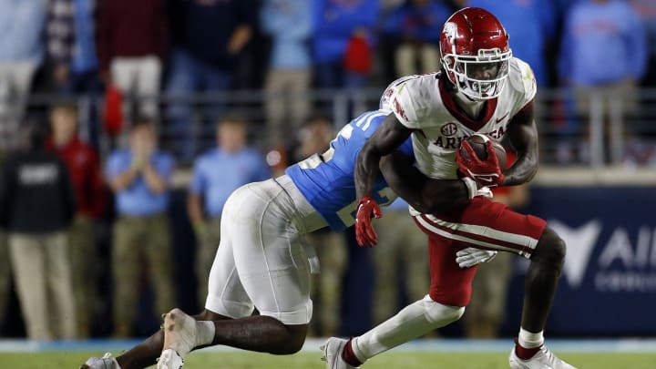 Oct 7, 2023; Oxford, Mississippi, USA; Arkansas Razorbacks wide receiver Andrew Armstrong (2) runs after a catch as Mississippi Rebels defensive back Trey Washington (25) makes the tackle during the second half  at Vaught-Hemingway Stadium. Mandatory Credit: Petre Thomas-USA TODAY Sports