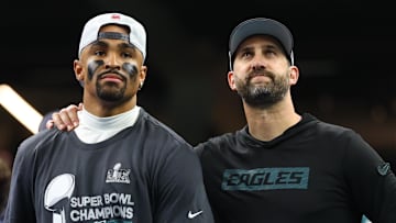 Feb 9, 2025; New Orleans, LA, USA; Philadelphia Eagles head coach Nick Sirianni and Philadelphia Eagles quarterback Jalen Hurts (1) on the podium after defeating the Kansas City Chiefs in Super Bowl LIX at Ceasars Superdome. Mandatory Credit: Mark J. Rebilas-Imagn Images
