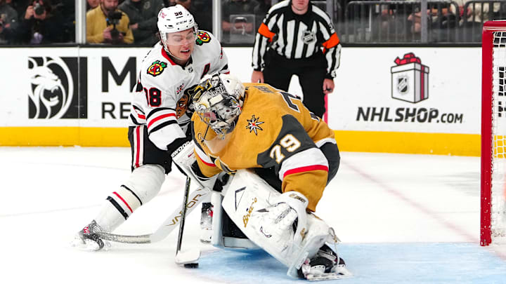 Dec 2, 2025; Las Vegas, Nevada, USA; Chicago Blackhawks center Connor Bedard (98) scores a goal against Vegas Golden Knights goaltender Carter Hart (79) during a shoot out at T-Mobile Arena. Mandatory Credit: Stephen R. Sylvanie-Imagn Images