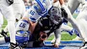 Detroit Lions linebacker Jack Campbell (46) sacks Dallas Cowboys quarterback Dak Prescott (4) during the first half at Ford Field in Detroit on Thursday, Dec. 4, 2025.