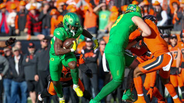 Oregon running back Noah Whittington carries the ball for the Ducks as the No. 9 Oregon Ducks take on the No. 21 Oregon State Beavers at Reser Stadium in Corvallis, Ore. Saturday, Nov. 26, 2022.

Ncaa Football Uo Vs Osu Rivalry Game University Of Oregon At Oregon State