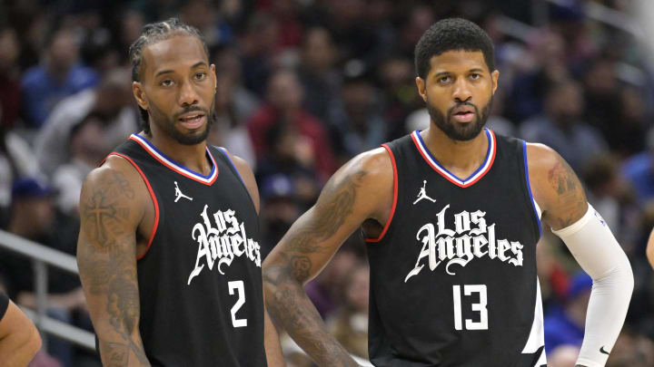 Feb 10, 2024; Los Angeles, California, USA;   Los Angeles Clippers forward Kawhi Leonard (2) and forward Paul George (13) look on in the second half against the Detroit Pistons at Crypto.com Arena. 