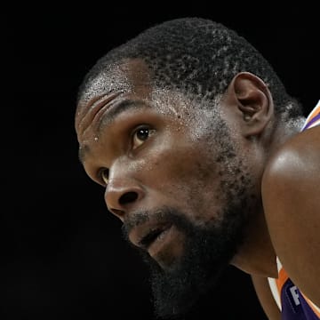 Mar 17, 2025; Phoenix, Arizona, USA; Phoenix Suns forward Kevin Durant (35) during a timeout in the second half against the Toronto Raptors at Footprint Center. Mandatory Credit: Rick Scuteri-Imagn Images