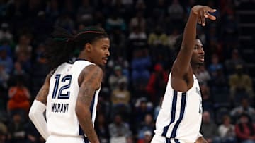 Nov 25, 2024; Memphis, Tennessee, USA; Memphis Grizzlies guard Ja Morant (12) and forward Jaren Jackson Jr. (13) react during the second half against the Portland Trail Blazers at FedExForum.