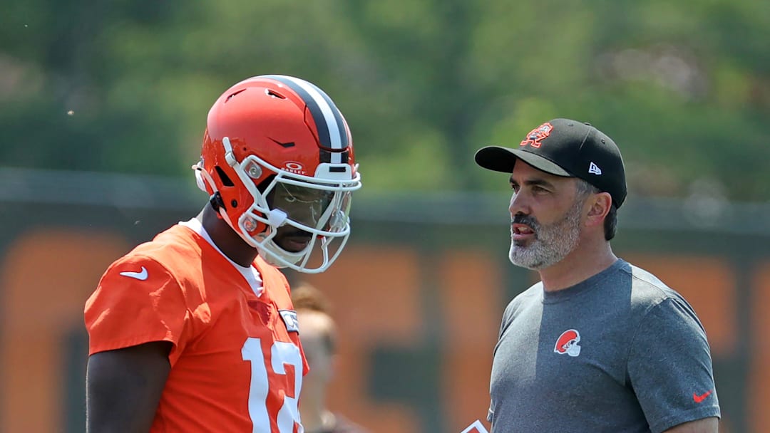 Cleveland Browns quarterback Shedeur Sanders (12) speaks with head coach Kevin Stefanski during practice at NFL minicamp, Wednesday, June 11, 2025, in Berea, Ohio.