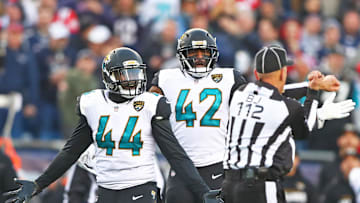Jan 21, 2018; Foxborough, MA, USA; Jacksonville Jaguars linebacker Myles Jack (44) and safety Barry Church (42) react to a unnecessary roughness penalty against the New England Patriots in the AFC Championship Game at Gillette Stadium. Mandatory Credit: Mark J. Rebilas-Imagn Images