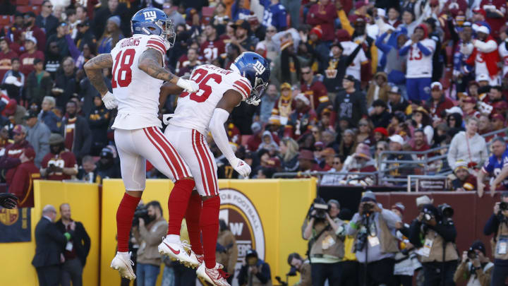 Nov 19, 2023; Landover, Maryland, USA;  New York Giants wide receiver Darius Slayton (86) celebrates with Giants wide receiver Isaiah Hodgins (18) After catching a touchdown pass against the Washington Commanders during the second quarter at FedExField.  