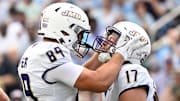 Sep 21, 2024; Chapel Hill, North Carolina, USA; James Madison Dukes tight end Taylor Thompson (17) reacts with tight end Josh Phifer (89) after scoring a touchdown in the second quarter at Kenan Memorial Stadium. Mandatory Credit: Bob Donnan-Imagn Images
