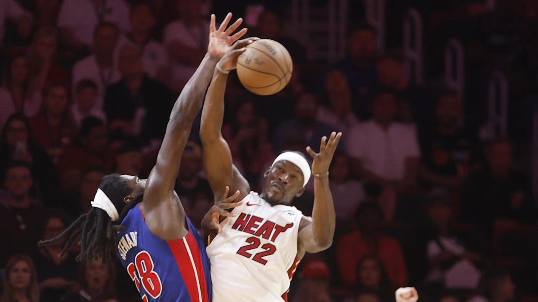 Oct 28, 2024; Miami, Florida, USA;  Miami Heat forward Jimmy Butler (22) is fouled by Detroit Pistons center Isaiah Stewart (28) during the first half at Kaseya Center. 