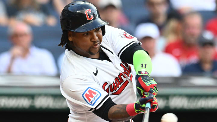 Aug 1, 2024; Cleveland, Ohio, USA; Cleveland Guardians third baseman Jose Ramirez (11) hits a sacrifice fly during the first inning against the Baltimore Orioles at Progressive Field. Mandatory Credit: Ken Blaze-USA TODAY Sports