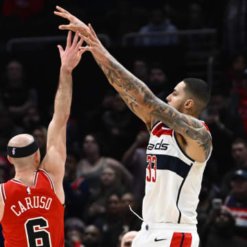 Jan 11, 2023; Washington, District of Columbia, USA; Washington Wizards forward Kyle Kuzma (33) hits the game winning three point basket over Chicago Bulls guard Alex Caruso (6) during the second half at Capital One Arena. Mandatory Credit: Brad Mills-USA TODAY Sports