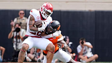 Oklahoma State's Nick Martin (4) tackles Arkansas' Ja'Quinden Jackson (22) first half of the college football game between the Oklahoma State Cowboys and the Arkansas Razorbacks at Boone Pickens Stadium in Stillwater, Okla.,, Saturday, Sept., 7, 2024.