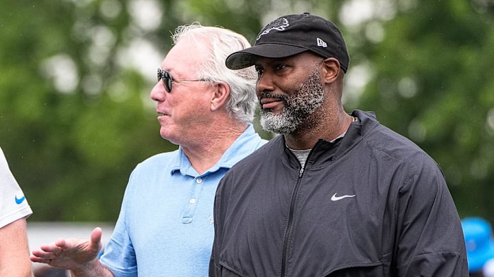 Detroit Lions head coach Dan Campbell, left, talks to team president and CEO Rod Wood and general manager Brad Holmes after practice during training camp at Meijer Performance Center in Allen Park on Sunday, July 20, 2025.