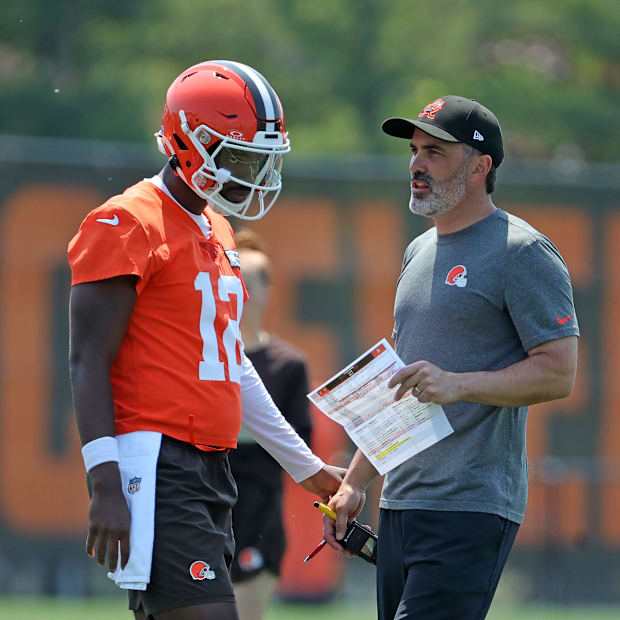 Cleveland Browns quarterback Shedeur Sanders (12) speaks with head coach Kevin Stefanski during practice at NFL minicamp, Wed